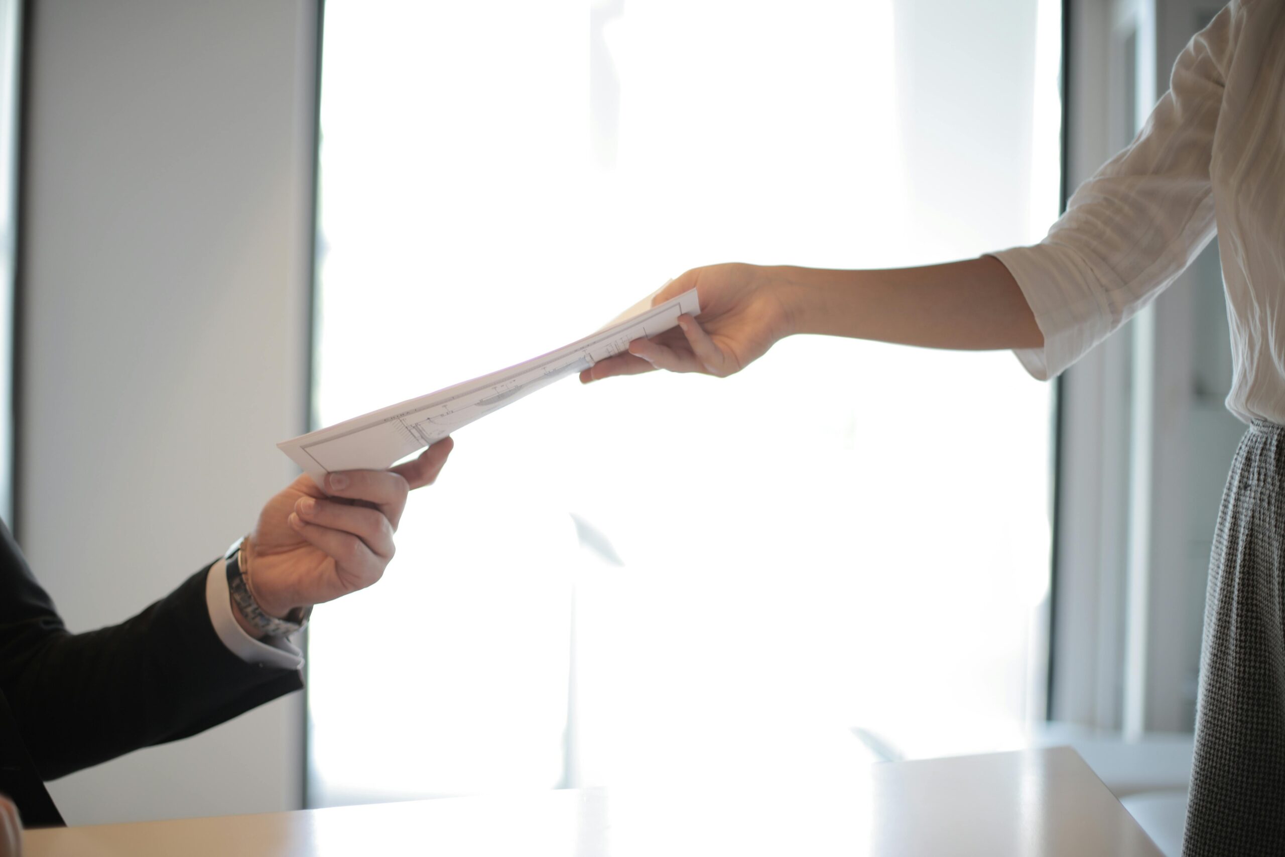 An applicant submits paperwork for NMSDC minority-owned business certification.